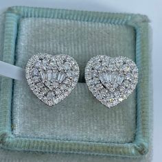 Beautiful Heart Shape Diamond Earrings White Gold.   Excellent craftsmanship, all diamonds are set smooth and sparkles tons.  Sits nice on the ear.  Set with minimal prongs showing, very pretty shape.  Measures 12mm.  The push backings have two security notches  for a secure fit.  Good quality diamonds, you don't see black carbon spots when viewed under a magnifying glass.  You will love how sparkly these earrings are!  Genuine Earth Mined Round Brilliant Cut Diamonds Natural  Total weight: 1.32 Luxury Cubic Zirconia Heart Cut Earrings, Luxury Heart Cut Diamond Earrings, Luxury Heart-shaped Brilliant Cut Earrings, Fine Jewelry Heart Cut Brilliant Earrings, Luxury Diamond Earrings For Valentine's Day, Valentine's Day Vvs Clarity Diamond Earrings, Heart-shaped Vvs Clarity Diamond Earrings For Formal Occasions, Diamond White Heart Cut Brilliant Earrings, Diamond White Brilliant And Heart Cut Earrings