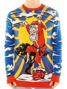 a man wearing an ugly sweater with santa clause on the front and blue sky in the background