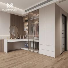 a large walk in closet with mirrored doors and mirrors on the wall next to it