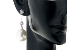 Classy dangle earrings, made of 18k solid white gold with 0.500ct sparkling genuine natural diamonds & 2 natural white, genuine south sea cultured pearls from Australia. Each of the Top grade Fine Drop shape, genuine south sea white pearl exhibits excellent high luster, thicker nacre with silky smooth and clean surface. Style: Dangle. Metal Purity: 18k Solid White Gold. Genuine Diamonds: 28 pcs / 0.500ctw. Earring Weight: Pearl Type: Genuine South Sea Cultured Pearl. Pearl Origin: Broome; We Elegant White Platinum Bridal Earrings, Elegant White Platinum Earrings, White Drop Diamond Earrings With Brilliant Cut, Elegant Platinum Drop Earrings, Elegant White Bridal Earrings With Brilliant Cut, White Platinum Dangle Diamond Earrings, Elegant White Diamond Earrings With Brilliant Cut, Elegant Platinum Dangle Earrings, White Brilliant Cut Drop Bridal Earrings