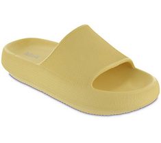 a pair of yellow slippers sitting on top of each other