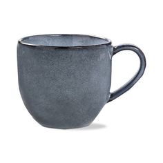 a gray coffee cup sitting on top of a white table