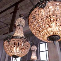 chandeliers hanging from the ceiling in an old building