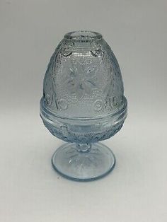 an old glass candle holder on a white background