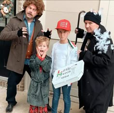 three adults and two children dressed up as little caesar, the boy is holding a sign that says little caesar