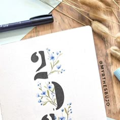 a notebook with numbers and flowers on it