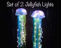 two jellyfish lights in the dark with text that reads set of 2 jellyfish lights