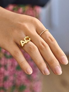 Create a sentimental staple for your everyday ring stack with the 18K Gold Double Initial Custom Block Ring. Your initials, or the initials of you and a loved one, will be added onto this ring in a bold, raised-block font. The entire ring will be crafted out of 18K gold plated sterling silver, so this statement piece will stay beautiful for years to come. Everyday Yellow Gold Polished Initial Ring, Luxury Open Initial Ring For Everyday, Luxury Everyday Open Initial Ring, Personalized Yellow Gold Signet Ring For Everyday, Luxury Open Ring With Initial For Everyday, Fine Jewelry Stackable Initial Open Ring, Classic Monogram Engraved Ring For Everyday, Classic Engraved Monogram Ring For Everyday, Stackable Open Ring Initial In Fine Jewelry