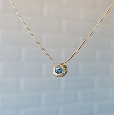 The Aurora Slide Necklace is a shining, luxe beam of light surrounding a pool of rich denim blue Montana sapphire. The hand-engraved lines reflect its shimmering radial pattern, and the center stone is carefully chosen for its captivating color and sparkle. The pendant floats on a smooth curb chain, ideal for stacking on additional Aurora pendants or charms. The Aurora necklace is a stunning beam of sunlight, hung around your neck. Product Details .15ct (3mm) Medium Denim Blue Montana Sapphire 1 Aurora Necklace, Hand Carved Jewelry, Radial Pattern, Beam Of Light, Montana Sapphire, The Aurora, Gold Necklace Designs, Curb Chain, Hand Engraving