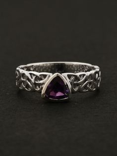 $35.00 | Create a lasting impression and turn heads wherever you go with this minimalistic Celtic knot ring in natural Amethyst. The perfect unique gift for her. Silver Celtic Rings, celtic rings women, celtic rings engagement, unique minimalistic wedding rings, minimalistic rings silver, minimalistic rings celtic, celtic knot designer ring, minimialistic rings stacking, silver enagegement ring, amethyst ring vintage, amethyst ring simple, amethyst ring silver, amethyst ring silver band, unique Mystical Amethyst Ring As A Gift, Spiritual Amethyst Birthstone Ring In Sterling Silver, Spiritual Sterling Silver Amethyst Birthstone Ring, Spiritual Purple Crystal Birthstone Ring, Spiritual Amethyst Ring, Silver Amethyst Ring In Mystical Style, Silver Amethyst Ring, Spiritual Birthstone, Purple Crystal Ring For Promise, Adjustable Hallmarked Amethyst Ring Gift