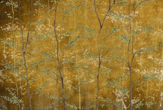 an image of a painting on the wall with trees and leaves painted on it's side