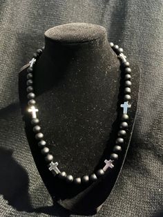 Grab this custom Blackout all Black inspired beaded necklace.  All matte black Beaded Necklace with Silver Crosses!  w/ magnetic clasp for easy and comfort. 18-20in Colors of the Sea! Elevate your style AND your game with our vibrant, handcrafted beaded necklace.   Look Good, Feel Good, Feel Good Play Good! BLING BLING ⚾️🏈⚽️🏀⚾️️ 📿 Baseball Football Soccer Softball Basketball 🌟 Features: 🌟 Unique Design 💎 Quality Matters: Thick Elastic band and magnetic clasps ensure durability and long-las Black Spiritual Jewelry For Party, Spiritual Black Jewelry For Party, Black Beaded Chain For Gift, Black Beaded Chain As A Gift, Black Beaded Chain Beads As Gift, Spiritual Black Necklaces For Party, Handmade Black Onyx Beaded Necklaces, Black Spiritual Necklaces With Large Beads, Spiritual Black Necklaces With Large Beads