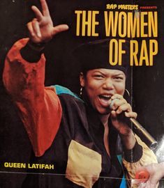 the woman of rap magazine cover with queen latifah holding up her hand