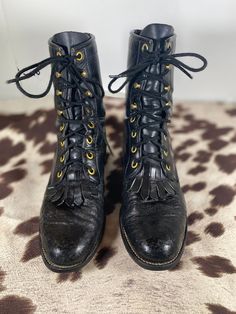 Rare, Justin Women's 6B, Kiltie, Soft Black Bull Hide Leather, Lace-up Ankle boot that will stand out and compliment any outfit. On the toe and the heel of these boots are genuine bull hide that has a slightly different appearance and give these boots an opportunity to stand out! These boots are in next to perfect condition and they will definitely become a talking point to any social gathering. There are no rips or tears and the soles are in great shape. The leather is soft, supple and well con Fitted Black Gothic Lace-up Boots, Fitted Black Grunge Boots, Vintage Black Lace-up Winter Boots, Vintage Black Lace-up Boots For Winter, Black Steampunk Boots For Fall, Black Steampunk Lace-up Boots, Vintage Black Lace-up Boots For Fall, Boots Steampunk, Womens Booties