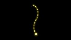 an arrow is glowing in the dark with yellow light on it's side,