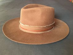 "Firm wide brim brown felt Fedora Cowboy Hat ... bohemian / hippie style... purchased at Abiquiu Inn / Georgia O'keefe welcome center, Abiquiu, New Mexico...  in excellent like new condition, worn only once... Western / Southwestern Nomad... with leather & frayed band finish... large, 59cm From hat maker's listing (along with the last 3 photos) : This Felt Fedora Hat is the rancher style hat of your dreams. Featuring a frayed texture band with a leather accent strip and a wide brim, it is guaran Brown Leather Felt Hat For Rodeo, Western Style Brown Leather Felt Hat, Western Style Brown Fur Felt Hat Bands, Western Brown Fur Felt Hat Bands, Brown Fedora For Rodeo In Fall, Brown Leather Felt Hat For Fall, Western Brown Fedora With Flat Crown, Western Style Brown Fedora With Flat Crown, Brown Fur Felt Hat Band For Ranch