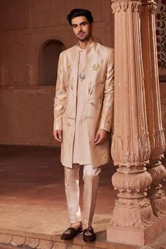 Beige sherwani with bageecha hand painted motifs and dabka, zardozi embroidery. Paired with kurta and pant. - Aza Fashions Designer Mirror Work Kurta For Diwali, Designer Straight Kurta With Mirror Work, Designer Sherwani With Mirror Work And Straight Kurta, Designer Nehru Jacket With Mirror Work For Festive Season, Designer Embroidered Sherwani Kurta, Traditional Raw Silk Nehru Jacket With Mirror Work, Traditional Nehru Jacket With Mirror Work In Raw Silk, Designer Kurta With Mirror Work For Eid, Eid Nehru Jacket With Mirror Work In Raw Silk