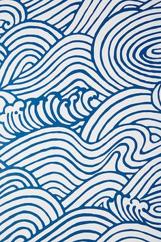 a blue and white wallpaper with waves on it