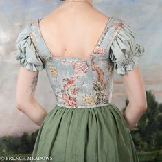 This blue floral corset is as delicately lovely as it is durable and supportive. The antique light blue fabric looks as if it's been painted on, and will fit right in with pastoral backdrops of the 18th century, or among the fair folk of your local Renaissance festival. Its light boning and strong cotton canvas lining ensures unparalleled support and stability as you traverse the great outdoors, while the lacing at the front allows you to adjust the fit to your liking. You'll feel comfortable an Fair Folk, Parisian Blue, Light Blue Fabric, Floral Corset, The Fair, Antique Lighting, Fabric Swatches, Different Fabrics, Blue Fabric