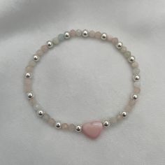 Introducing our Blush Heart and Gemstone Bead Bracelet in radiant sterling silver—a true embodiment of joy and elegance! With its delicate blush heart charm and shimmering gemstone beads, this bracelet is a celebration of love and individuality. Each bead tells a story, reflecting the wearer's unique journey and personality. Whether you're adding a pop of color to your everyday look or stacking it with other treasures, this bracelet is sure to spark joy and conversation wherever you go. Embrace Puffy Heart Charms, Spark Joy, Gemstone Beaded Bracelets, Puffy Heart, Bracelet Sterling Silver, Pink Bracelet, Matching Bracelets, Pink Opal, Initial Charm