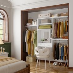 a bedroom with a bed, desk and shelves filled with clothes on hangers next to a window