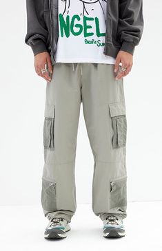 The Shadow Baggy Cargo Pants from PacSun offer a relaxed fit with wide legs, crafted from a durable cotton-nylon blend. Featuring a drawstring waistline, reinforced seams, side entry pockets, and cargo pockets with zipper details, these pants seamlessly blend practicality with contemporary style.


	Drawstring waistline
	Side pockets
	Welt back pockets
	Relaxed fit
	Cargo pockets with zip detail
	30" Inseam
	19.5" Leg opening
	Rigid
	66% Cotton, 34% nylon
	Machine washable
	Measurements taken from a size medium
	Model is wearing size medium
	Model Measurements: 6'2” Height, 30” Waist, 32” Inseam Khaki Sweatpants With Pockets For Streetwear, Streetwear Cargo Style Parachute Pants With Tapered Leg, Streetwear Straight Cargo Pants With Drawstring, Khaki Cargo Pocket Sweatpants, Urban Parachute Pants With Tapered Leg And Multiple Pockets, Techwear Wide Leg Parachute Pants With Patch Pockets, Streetwear Cargo Pants With Drawstring, Streetwear Parachute Trousers With Patch Pockets, Streetwear Wide-leg Cargo Pants With Drawstring