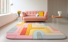 a living room with a pink couch and colorful rug