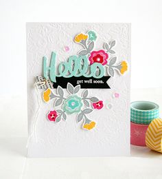 a close up of a card on a table with some crafting supplies around it