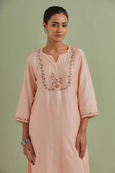 Peach kurta with floral embroidery and side slits. Paired with pant and cotton dupatta.
Components: 3
Pattern: Embroidered
Type Of Work: Floral
Neckline: Notched
Sleeve Type: Three quarter
Fabric: Chanderi silk, kota cotton
Color: Peach
Other Details: 
Side slits
Floral embroidery
Occasion: Puja - Aza Fashions Spring Sharara With Dori Work In Chanderi, Spring Chanderi Sharara With Dori Work, Spring Salwar Kameez With Dori Work, Peach Palazzo Set With Resham Embroidery, Elegant Spring Kurta With Dori Work, Peach Sharara With Resham Embroidery, Peach Straight Kurta With Zari Work, Peach Chanderi Salwar Kameez, Peach Chikankari Embroidery Set