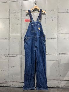 Good vintage condition. Clean. Marked 42x32. Please review measurements as some vintage items fit smaller than modern sizing. Measurements taken with garment laid flat: 22" across the waist 23" across hips 31" inseam, from intersection to hem 14.5" rise, from intersection to top of waist Please send a message if you have any questions. Double check measurements and inspect all pictures carefully before purchasing. Orders ship via USPS. All sales are final, we do not accept returns.  Follow on In Carhartt Bibs, Jeans Diy, Bib Overalls, Blue Denim, Overalls, Vintage Items, Gender Neutral, Adult Outfits, Blue