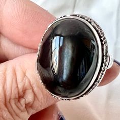 This Is A Great , Unusual ,Statement Vintage Ring!!! What A Prominent Cabochon Stone ! This Dark Grayish Black Stone With A Visible Cats Eye / Star In It (Possibly Moonstone? ) , I Am Unsure What The Stone Is , But It Is Breathtaking And Glows When You Move Your Hand ( The Pictures Were Unable O Translate The Exact Beauty) .It Is Stamped And Also Was Acid Tested For Sterling Silver. Size 7.5 On Ring Mandrel, Weights A Whooping 17.02 Grams ! The Cabochon Stone Is Approx. 19mm Long By 14mm Wide.Truly A Beauty !!! Silver Cabochon Moonstone Ring For Formal Occasions, Formal Silver Moonstone Cabochon Ring, Formal Silver Moonstone Ring With Cabochon, Elegant Silver Ring Cabochons, Elegant Silver Cabochons For Gifts, Silver Gemstone Cabochons, Silver Round Cabochons With Polished Finish, Black Moonstone Gemstone Ring, Ring Mandrel