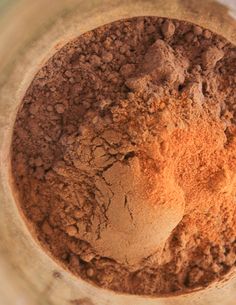 a bowl filled with dirt sitting on top of a table