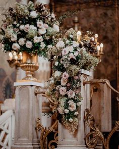 an elaborately decorated table with flowers and candles