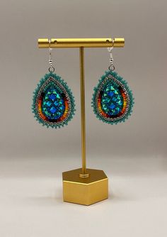 Large indigenous style beaded tear drop earrings.  These will only come in turquoise and red.  Dress them up or down, they will complete any outfit.  Super sparkly, lightweight and hypoallergenic.  These can be customized for clip-ons. Multicolor Beaded Teardrop Earrings, Multicolor Teardrop Beaded Earrings, Bohemian Teardrop Earrings With Colorful Beads, Beaded Dangle Teardrop Earrings For Festivals, Artisan Teardrop Beaded Earrings With Dangling Beads, Unique Handmade Teardrop Beaded Earrings, Festival Teardrop Earrings With Ear Wire, Adjustable Beaded Teardrop Earrings, Colorful Beads Teardrop Jewelry For Crafting