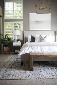 a large bed sitting in a bedroom on top of a rug