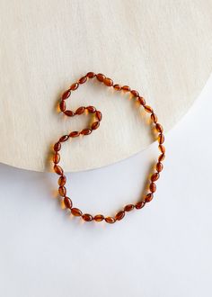 Luxury Amber Agate Necklaces, Luxury Baltic Amber Necklace In Amber Color, Luxury Amber Oval Beaded Necklace, Luxury Carved Amber Necklaces, Amber Bead Necklace, Tree Sap, Baby Necklace, Baltic Amber Necklace, Peace And Calm