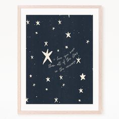 an art print with stars and the words love is in the air, written on it