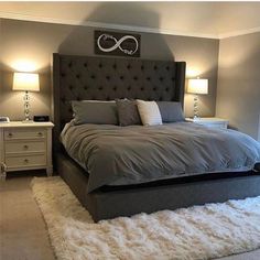 a bedroom with gray walls and white carpet