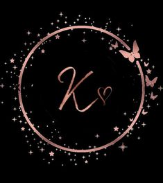 the letter k is surrounded by stars and a circle with pink butterflies on black background