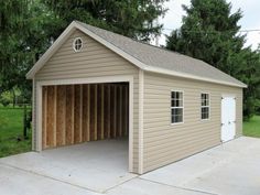 a two car garage with the door open