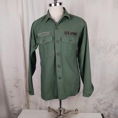 Very nice thick and soft cotton sateen US Army shirt....made in 1969...Vietnam eraOG 107. The shirt is in really nice condition. No holes or stains. No fraying. All buttons are there. Clean and ready to go.  Tag says 15 1/2 x 35....measurements: Armpit to armpit    22 inches Sleeve, from shoulder seam to end of cuff   25 inches Shoulder to shoulder   16 1/2 inches Length, from rear collar seam to end of shirt  28 inches Cotton Long Sleeve Camp Shirt With Button Closure, Vintage Streetwear Shirt With Pockets, Military Cotton Shirt For Streetwear, Military Style Long Sleeve Cotton Shirt, Military Style Collared Cotton Top, Cotton Military Shirt For Streetwear, Military Style Cotton Shirt For Streetwear, Military Style Cotton Long Sleeve Shirt, Military Style Cotton Shirt With Relaxed Fit