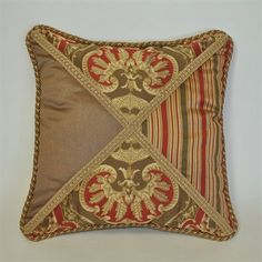 a brown and red pillow with an ornate design