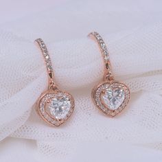 This Halo Drop Dangle Earring marvelously unleashes a classic hoop encrusted with sparkling stones holding a beautiful heart cut diamond sparkling flawlessly enclosed by a captivating halo studded with tiny shimmering round shaped stones arranged in an elegant pave setting. Further accentuating the earring is a filigree design for an added panache and splendor.  Heart and round cut diamonds of 1.39 Total Carat Weight in a prong and pave setting. Total Number of Stones:- 60  This diamond earring can also be customized with other different gemstones and metals of your preference. Free shipping within USA. 1 Year Manufacturing Warranty. 30 Days Return Policy with Lifetime Upgrade. Direct manufacturing price. Natural Conflict Free Diamonds. Pay with ease choosing from the wide range of pa Heart Halo, Halo Diamond Earrings, Silver Chain Earrings, Teal Earrings, September Birthstone Jewelry, Unique Diamond Rings, Bridesmaid Jewelry Sets, Discount Jewelry, Heart Shape Pendant