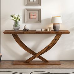 Elevate your home decor with the Modern Console Table, a stylish and functional piece designed to enhance the aesthetic appeal of any room. Featuring a unique cross-leg design, this side table beautifully combines architectural form with rustic charm, making it a versatile addition to your interior space. Crafted with a reinforced bottom plate, this console table offers superior weight support and stability, allowing you to confidently place your items on it without worrying about sturdiness. T… Modern Rustic Console Table, Entry Foyer Ideas, Rustic Entryway Table, Entrance Tables, Rustic Console Table, Minimalist Side Table, Wood Sofa Table, Rustic Console, Long Console Table