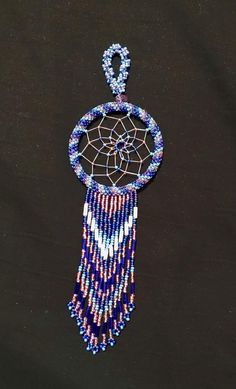 Handmade dreamcatcher, beadwork made in South Dakota, available to purchase for yourself, or as a gift! Item size and weight for packaging may vary. Dream catcher approximately 2 inches wide and 7 inches long. White Dreamcatcher, Dream Catcher White, Handmade Dreamcatcher, Native American Beadwork, Rapid City, South Dakota, Gift Item, Color Combos, Bead Work