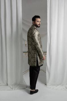 Upgrade your style with our Black and Gold Prince Coat. Made from luxurious brocade material, this front open coat exudes royalty. Paired with an Indian raw silk kurta pajama, it's the perfect ensemble for any formal event. Elevate your look and make a statement with this unique and elegant piece. 3-Piece Suit Designer Long Sleeve Sherwani For Formal Occasions, Designer Unstitched Bandhgala For Festive Occasions, Designer Formal Kurta With Stand Collar, Formal Long Sleeve Bandhgala With Naqshi, Designer Long Sleeve Kurta For Formal Occasions, Festive Designer Nehru Jacket With Stand Collar, Designer Stand Collar Kurta For Festive Occasions, Designer Festive Kurta With Stand Collar, Festive Designer Kurta With Stand Collar