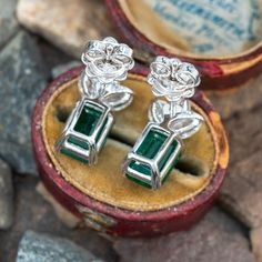 These beautiful earrings each feature an emerald cut emerald in a four split prong setting. The emeralds are topped by three (3) marquise brilliant cut diamonds in two-prong settings. The earrings measure 14.9mm long by 8.4mm wide and 5.7mm deep, finished with posts and friction backs for pierced ears. Green Emerald Cut Diamond Earrings For Formal Occasions, Green Emerald Cut Diamond Earrings For Formal Events, Emerald Cut Green Diamond Earrings For Formal Events, Emerald Cut Diamond Earrings For Formal Occasions, Formal Green Emerald Cut Diamond Earrings, Elegant Green Emerald Cut Diamond Earrings, Elegant Green Emerald-cut Diamond Earrings, Formal Baguette Cut Emerald Earrings, Formal Baguette-cut Emerald Earrings