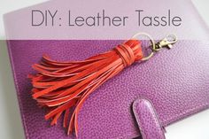 a purple purse with a tassel hanging from it's side and the words diy leather tassel on top