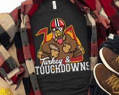 Turkey & Touchdowns Funny Thanksgiving Football Shirt is the perfect Thanksgiving day shirt to complement your Turkey dinner, mashed potatoes, stuffing, yams, pumpkin pie, and a nice glass of wine. Happy Turkey Day America! T-Shirt Details -- Adult-sized shirts are printed on Bella+Canvas 3001 Unisex Tees (unless otherwise noted) - Solid colors are 100% cotton, heather colors are 52% cotton, 48% polyester (Athletic Heather is 90% cotton, 10% polyester) - Pre-shrunk and run true to size. However, Stuffed Turkey Shirt, Dinner Mashed Potatoes, Thanksgiving Football Shirt, Funny Friendsgiving, Thanksgiving Football, Dinner Thanksgiving, Happy Turkey Day, Turkey Shirts, Fall Football