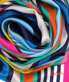 This versatile 100% silk scarf adds an accent in bold colors or striking neutrals. Trendy Multicolor Silk Scarf, Elegant Multicolor Scarves For Summer, Elegant Multicolor Summer Scarves, Spring Multicolor Silk Scarf, Elegant Multicolor Beach Scarves, Elegant Multicolor Beach Scarf, Chic Multicolor Summer Scarves, Chic Multicolor Scarves For Summer, Chic Multicolor Beach Scarves